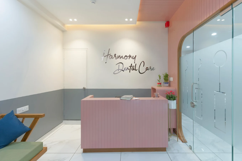 Ethereal warm lobby and reception desk at Harmony Dental Care Vadodara
